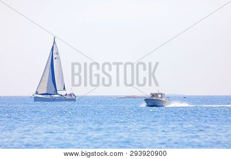 Grisslehamn, Sweden - Jul 18, 2018: One Sailship And One Motor Boat On The Blue Ocean In The Swedish