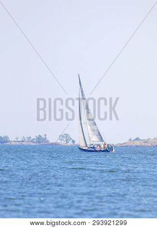 Soderarm, Sweden - Mar 18, 2018: Sailship On The Blue Ocean In The Swedish Archipelago, Islets In Th