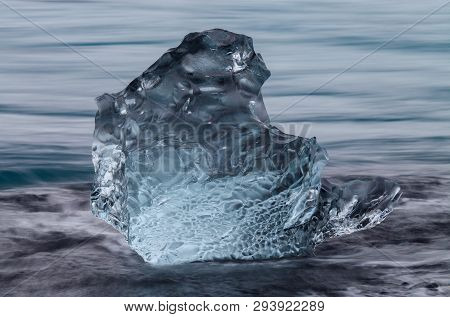 Amazing Transparent Blue Iceberg Pieces On Diamond Beach With Black Sand Near Jokulsarlon Lagoon, Ic