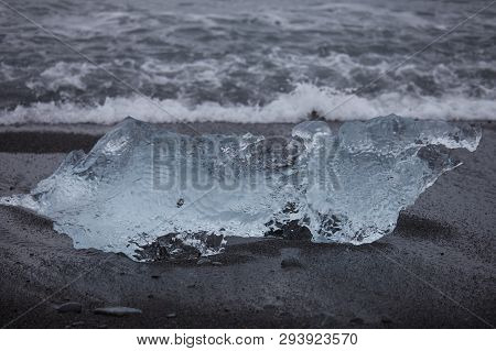 Amazing Transparent Blue Iceberg Pieces On Diamond Beach With Black Sand Near Jokulsarlon Lagoon, Ic