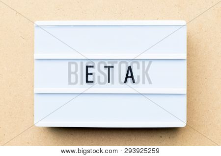 White Lightbox With Word Eta (abbreviation Of Estimated Time Of Arrival) On Wood Background