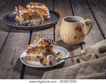 Homemade Cake Cut Into Pieces On Plates And A Large Ceramic Mug Of Tea