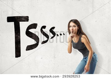 Young Brunette Girl Wearing Casual Jeans And T-shirt Showing Silent Gesture With Tsss Sign Isolated 