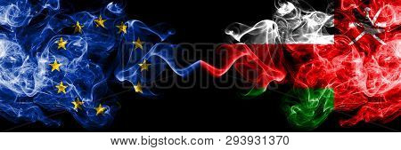 European Union Vs Oman, Omani Smoke Flags Placed Side By Side. Thick Colored Silky Smoke Flags Of Eu