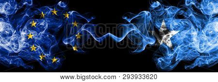 European Union Vs Somalia, Somalian Smoke Flags Placed Side By Side. Thick Colored Silky Smoke Flags