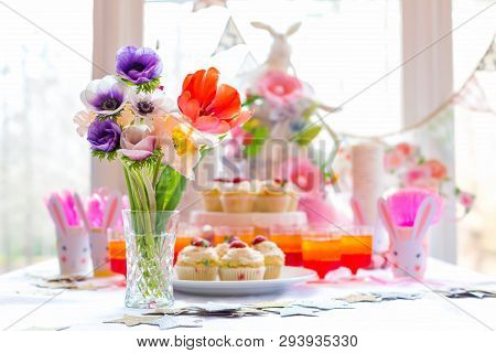 Dessert Table With Cupcakes And Flowers Easter Party Theme