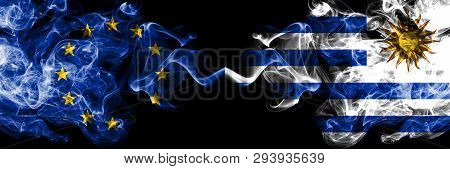 European Union Vs Uruguay, Uruguayan Smoke Flags Placed Side By Side. Thick Colored Silky Smoke Flag