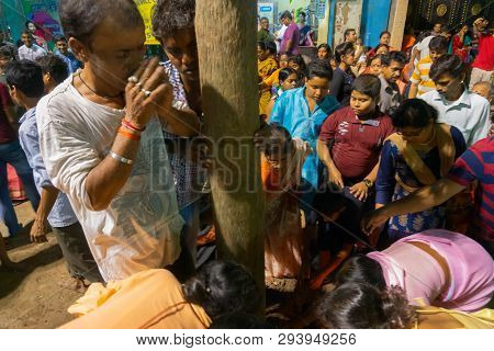 Howrah,west Bengal, India - April 15th, 2018 : Devotees Praying To Wood - During Gajan And Charak Pu