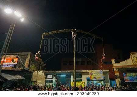 Kolkata, West Bengal, India - 15 April 2018: Two Hindu Devotees Are Hanging From Pole In Air, At Nig