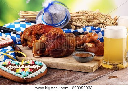 Traditional German Cuisine, Schweinshaxe Roasted Ham Hock. Beer, Pretzels And Various Bavarian Speci