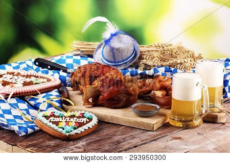 Traditional German Cuisine, Schweinshaxe Roasted Ham Hock. Beer, Pretzels And Various Bavarian Speci
