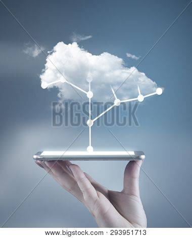 Hand Holding A Smartphone With A Circuit Board Tree And A Cloud Above