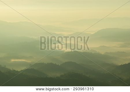 Mountains Valley With The Sea Of Fog And Clouds.layers Of Mountains In Morning Sunrise.