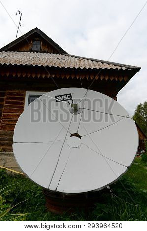 Altai Region, Russia - September 4, 2018: Satellite Dish Near The House In The Mountainous Siberian 