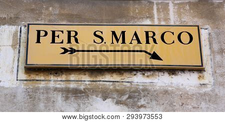 Yellow Road Sign In Venice In Italy With Directions To Square Of Saint Mark