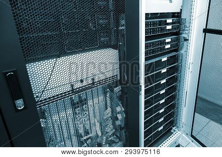 Severs Computer In Rack At Big Data Center Under Grid Door With Green Toning. Datacentre Interface A