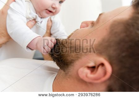 Baby Infant Hands Grab Beard Of Man