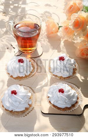 A Cup Of Tea And A Cake On A Sunny Table, A Bouquet Of Spring Flowers For Mood, Diet Food And A Heal