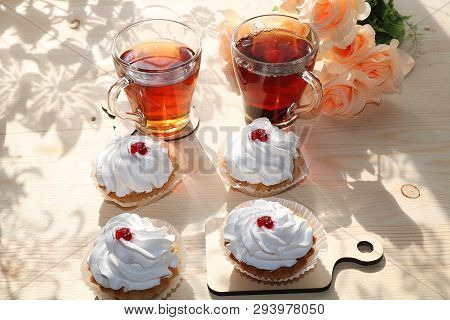 A Cup Of Tea And A Cake On A Sunny Table, A Bouquet Of Spring Flowers For Mood, Diet Food And A Heal
