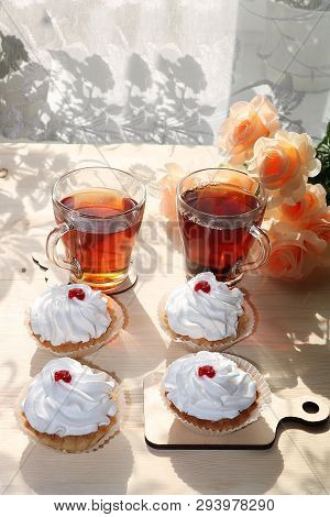 A Cup Of Tea And A Cake On A Sunny Table, A Bouquet Of Spring Flowers For Mood, Diet Food And A Heal