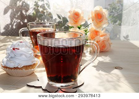 A Cup Of Tea And A Cake On A Sunny Table, A Bouquet Of Spring Flowers For Mood, Diet Food And A Heal