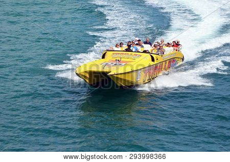 Tourists Enjoying A High Speed Sightseeing Waterfront Sightseeing Tour In A 