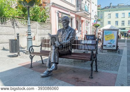 Tczew, Poland - June 26, 2020: Roman Landowski On Bench Sculpture.