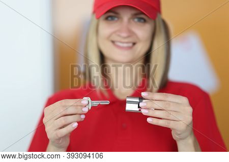 Master Holds Lock And Key In His Hands. Lock Picking Service Concept
