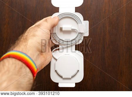 Paris, France - Nov 2, 2020: Man Unboxing Testing Of New Magsafe By Apple Computers A Proprietary Ma
