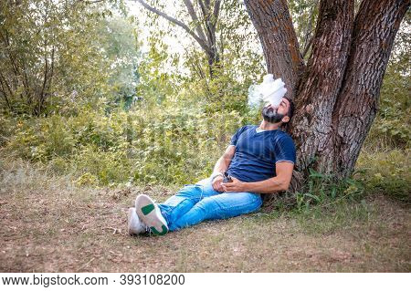 Confident Man Vaping And Releases A Cloud Of Vapor. Alternative To Smoking.