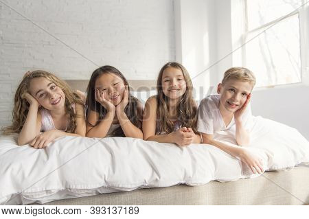 Large Group Of Her Friends Taking Goog Time On Bed