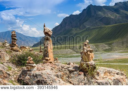 Stone Pyramids On The Background Of The Altai Mountains. Russia, Republic Of Altai, Valley Of The Ch