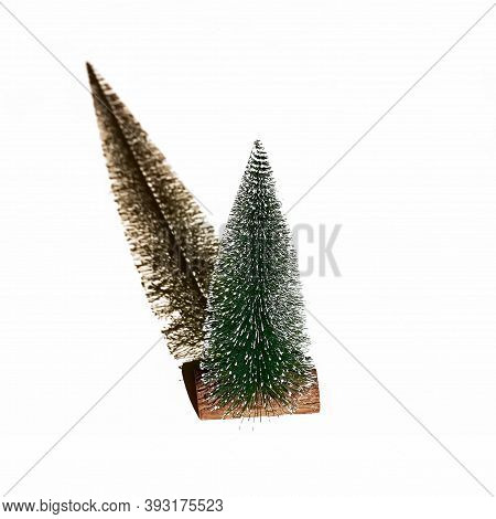 The Chrictmas Tree On A White Background Casts A Shadow. Illusion Of The Hands Of A Clock Showing Fi