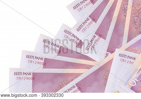 10 Estonian Kroon Bills Lies In Different Order Isolated On White. Local Banking Or Money Making Con