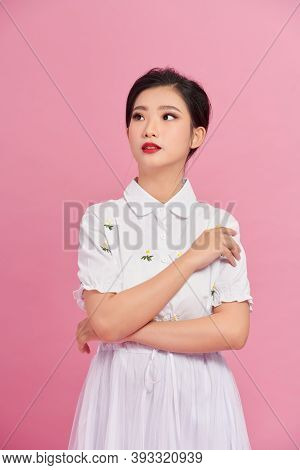Blithesome Woman In White Blouse Looking Up With Smile