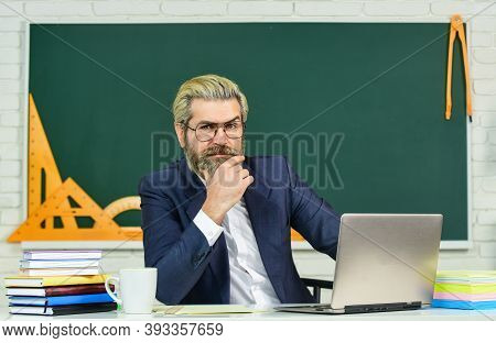 Digital Technology Enhances Education. Senior Teacher Use Laptop In Class. Using Computer Technology