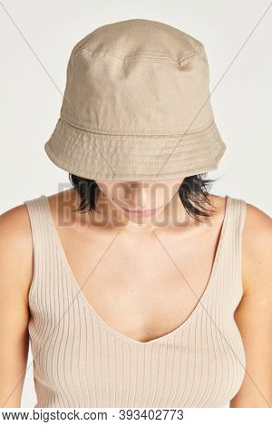 Woman in a beige bucket hat 