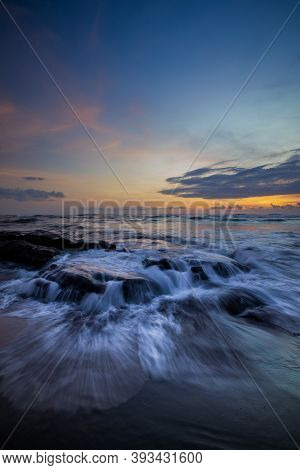 Amazing Seascape For Background. Beach With Rocks And Stones. Low Tide. Motion Water. Colorful Sky W