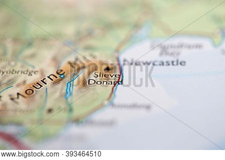 Shallow Depth Of Field Focus On Geographical Map Location Of Mount Slieve Donard In Northern Ireland