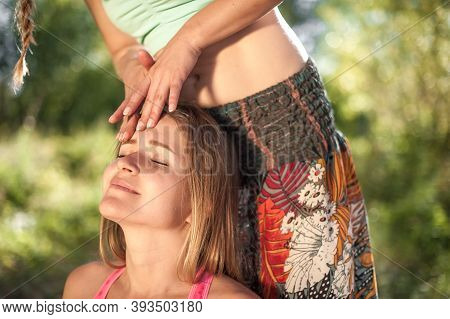 Proffesional Masseuse Impliments Her Massage Abilities On The Forest Ground.