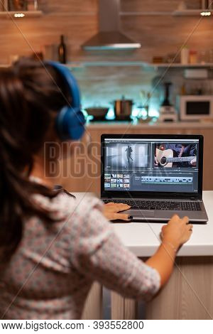 Movie Maker Editing A Film Using Modern Software For Post Production. Content Creator In Home Workin
