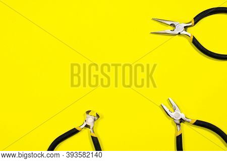 Tools On A Yellow Background With Space For Text. Pliers, Biters, Rounds, Tongs A Banner For A Const