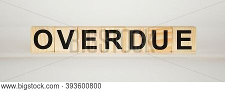 Overdue Invoices Concept. Word Overdue Written On Wooden Cubes