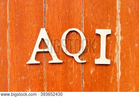 Alphabet Letter In Word Aqi (abbreviation Of Air Quality Index) On Old Red Color Wood Plate Backgrou