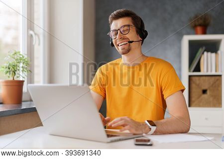Happy Laughing Man Wearing Headset Communicate By Conference Video Call With Friends Or Family. Free