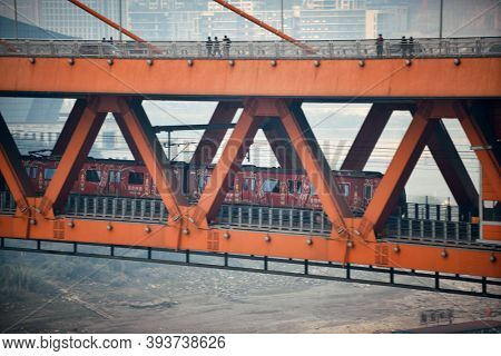 CHONGQING, CHINA â MARCH 13: Train in Dongshuimen Bridge on March 13, 2018 in Chongqing. With 17M population, it is the most populous Chinese municipality.
