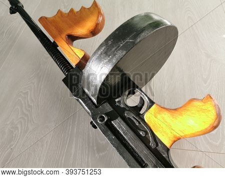 Hanged Wooden Thompson Machine Gun And Automatic Rifle Toys At Counter Of Souvenir