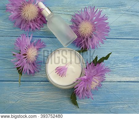 Cream Cosmetic Flower On Wooden Background Collection