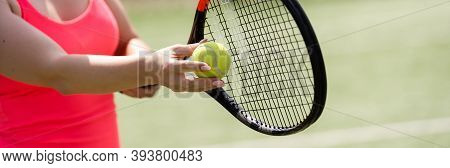 Close Up Of A Tennis Player Hitting The Ball With Racket