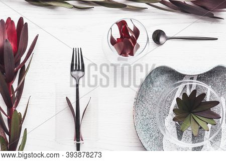 Elegant Table Setting With Floral Decor On White Wooden Background, Flat Lay